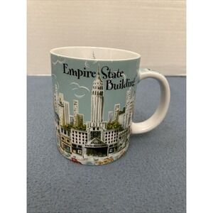 Empire State Building Coffee Mug featuring A Colorful NYC scene by Heidi Dobrott